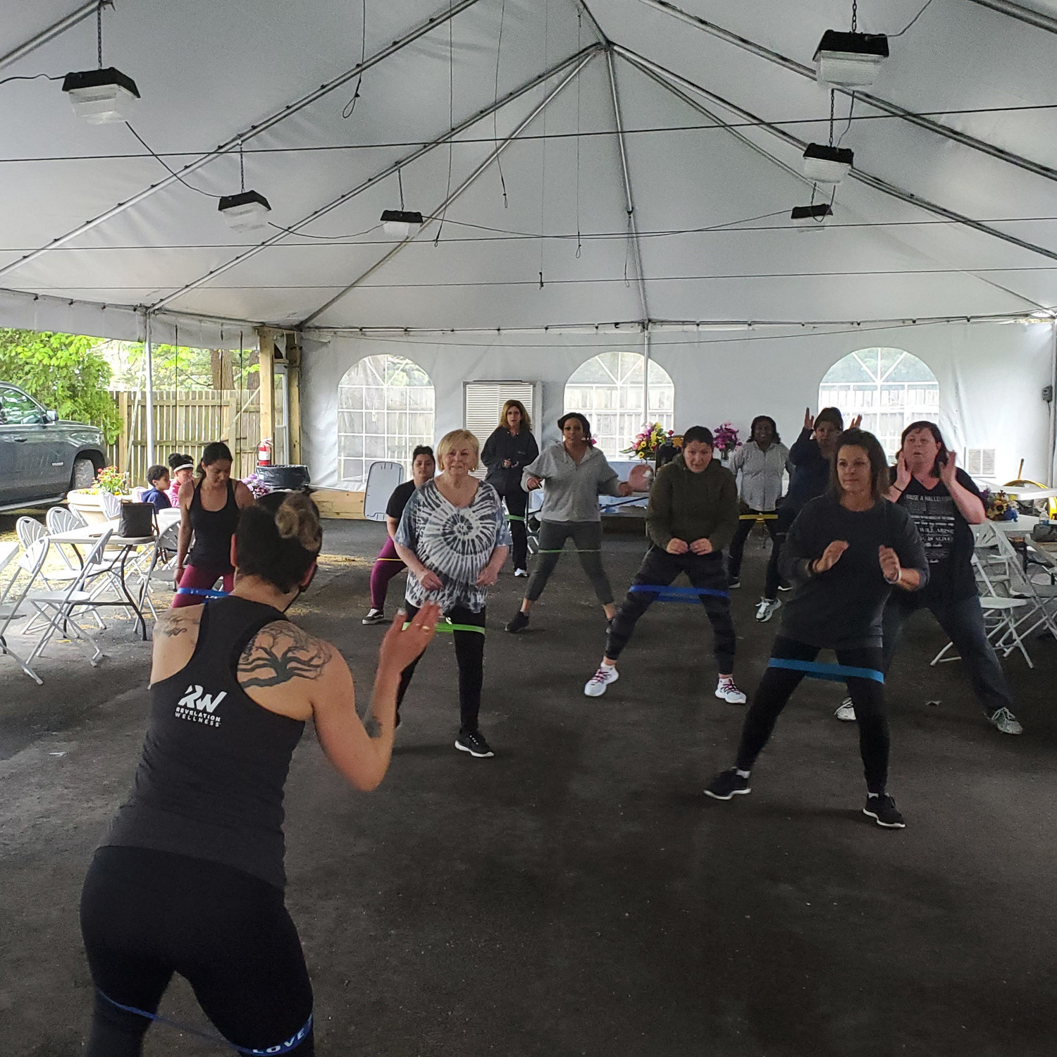 The Made Well fitness class takes place in a tent in back of South Bay Bible Church in East Moriches.